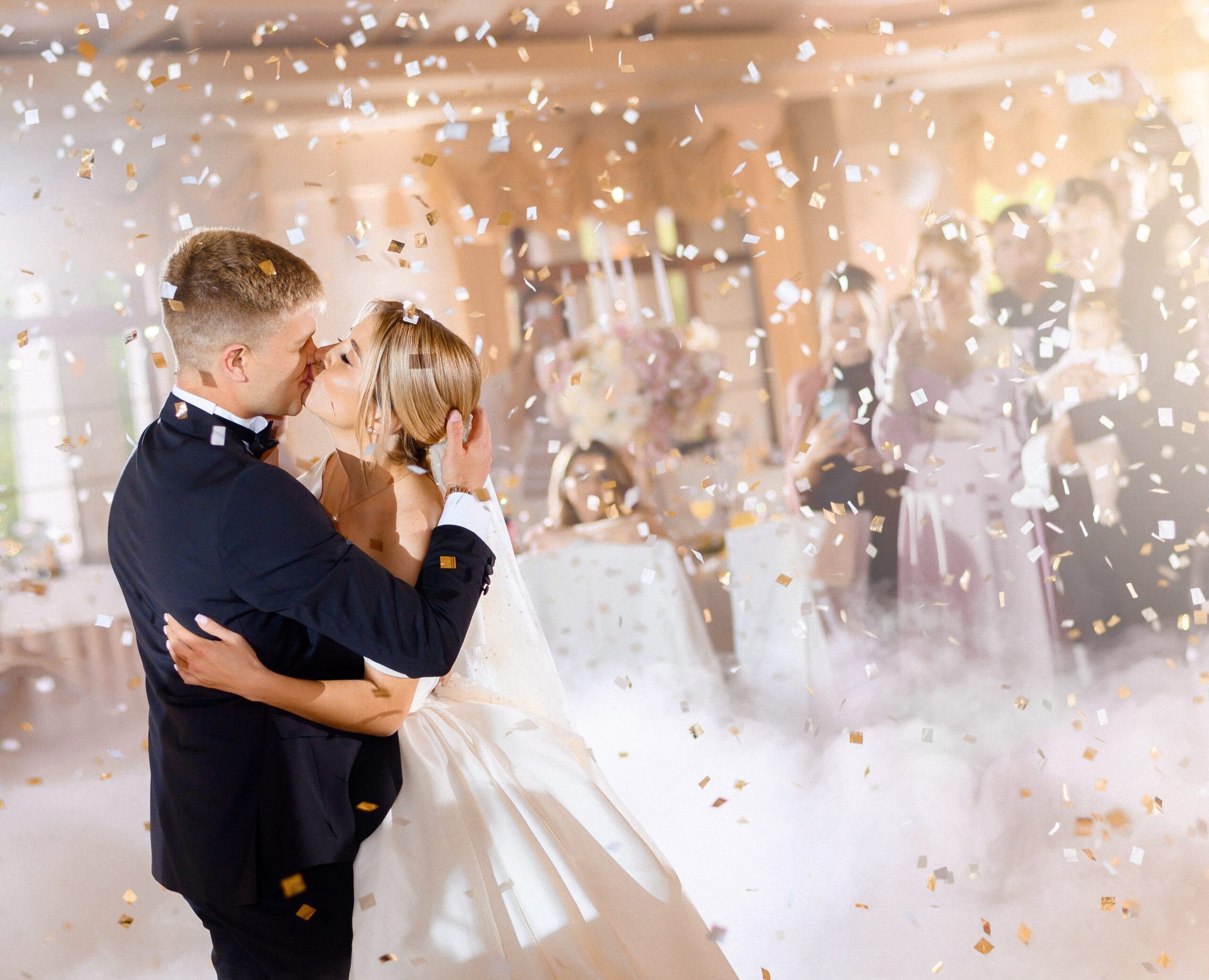 brides-kissing-and-hugging-while-falling-confetti
